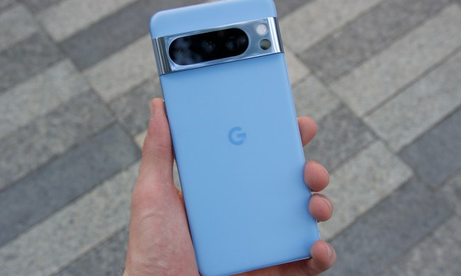 Someone holding the Bay blue Google Pixel 8 Pro.